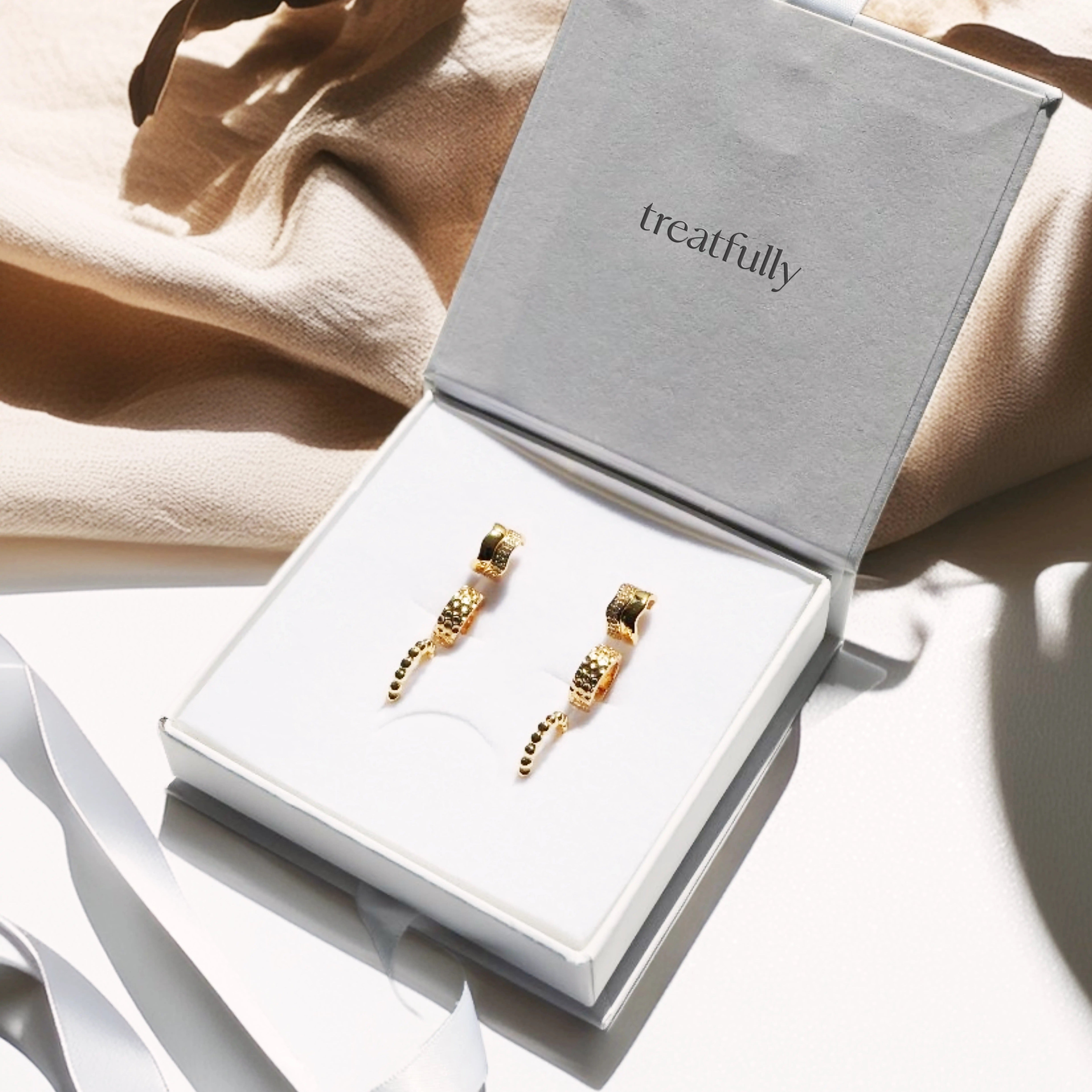 Luxury gold plated ear stack set featuring three huggie hoops, sterling silver earring gift box with wave bobble honeycomb designs