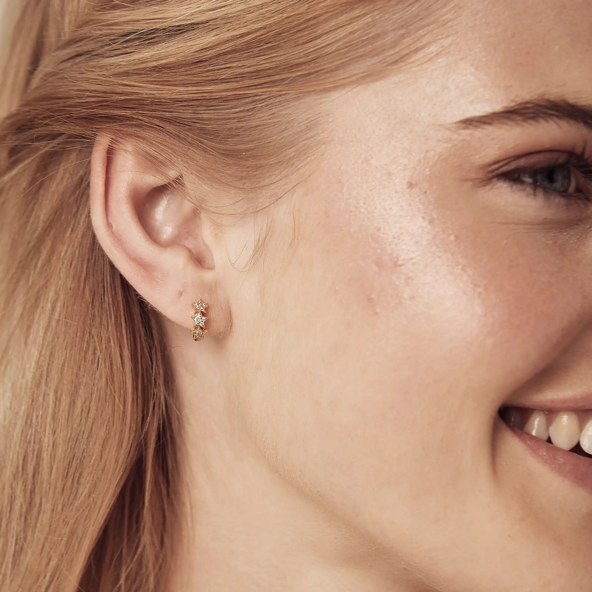 gold star huggies tiny star earrings treatfully