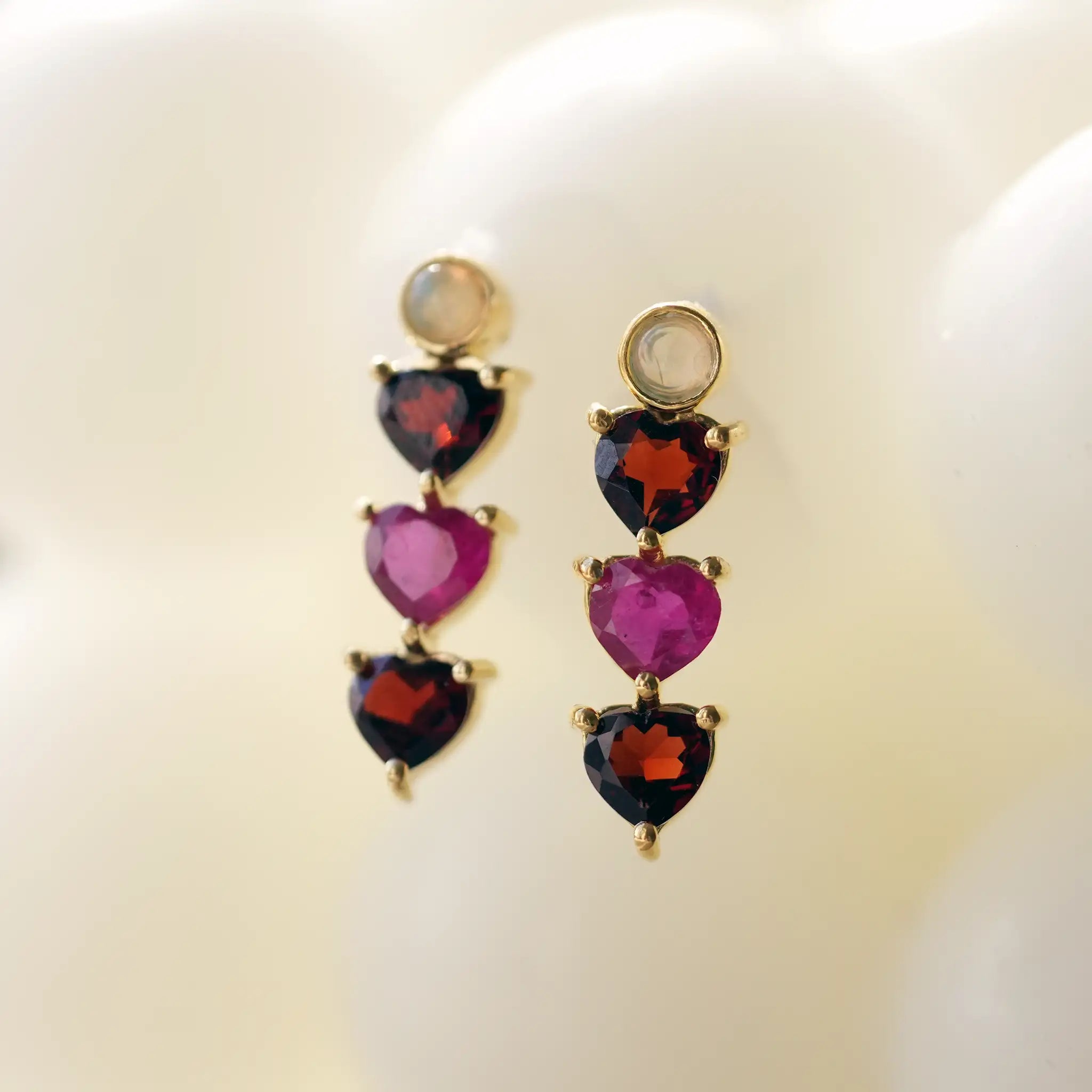 ruby and garnet earrings trilogy heart treatfully