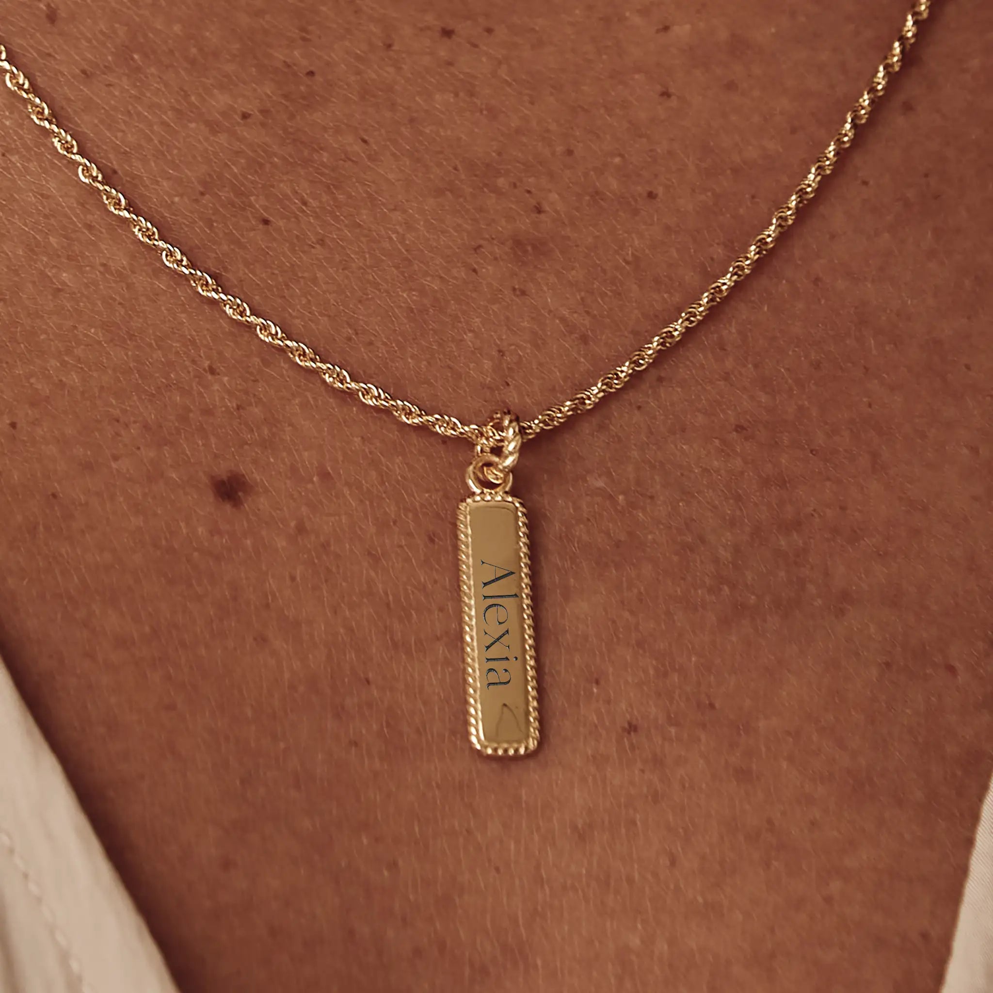 gold name tag necklace engraved with names or dates