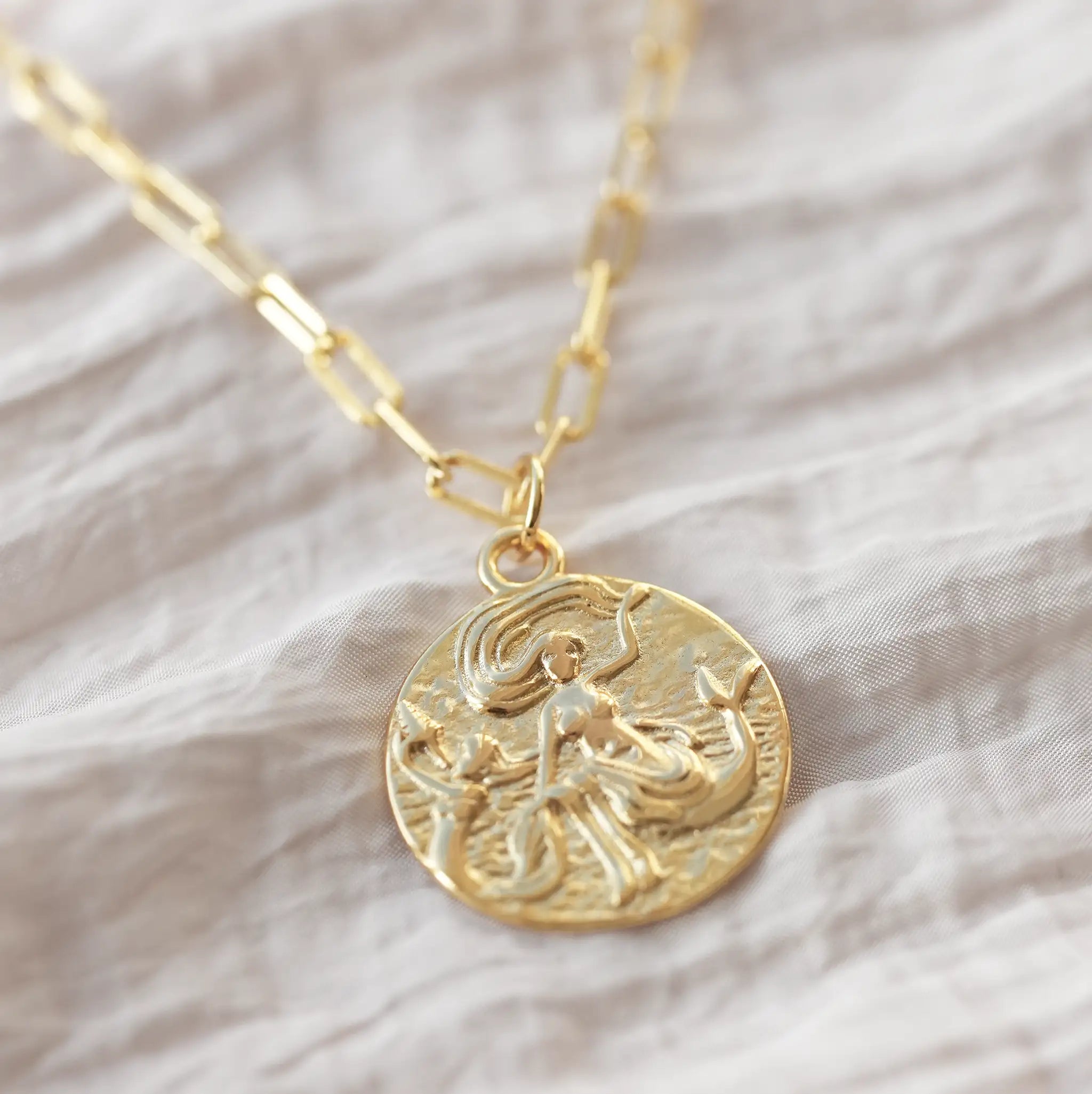 Mermaid pendant necklace uk a gold coin necklace featuring mermaids gifts for people with february and march birthday ideas